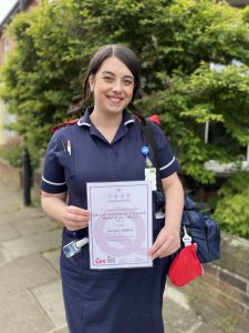 District Nurse Georgia Hibbert with her Philip Goodeve Docker Memorial Prize certificate