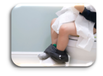 Image of a child on the toilet scrunching toilet paper