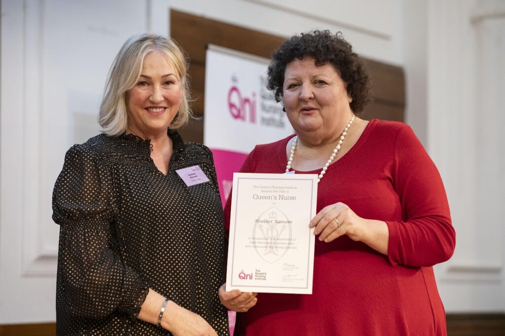 Heather Ransom receiving QNI Certificate from Professor Deborah Sturdy