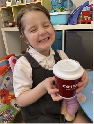 Grace Fisher with her reusable coffee shop cup