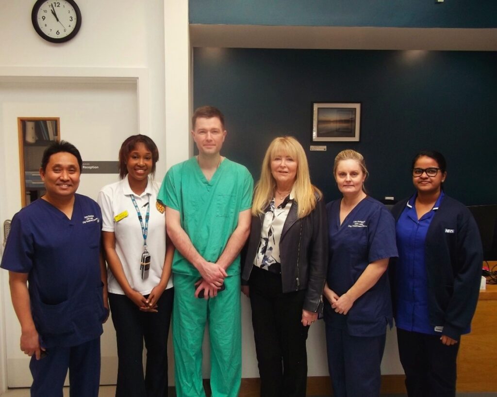 From Left to Right: Exton Sanchez, Day Treatment Centre unit lead, Deborah Michura,  advanced physiotherapist, Mr Philip Dobson, orthopaedic consultant,  Glenda Ellison the first day-case total knee replacement patient,  Lisa Hodgson, Day Treatment Centre unit lead, Chinchu Alex, nurse specialist.