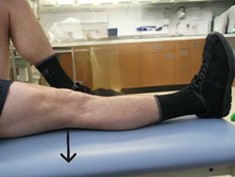 Person laid on back with one need bent and one out in front of them.