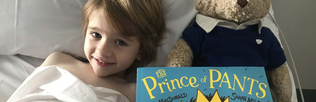 Ezekiel with his Read for Good book - large