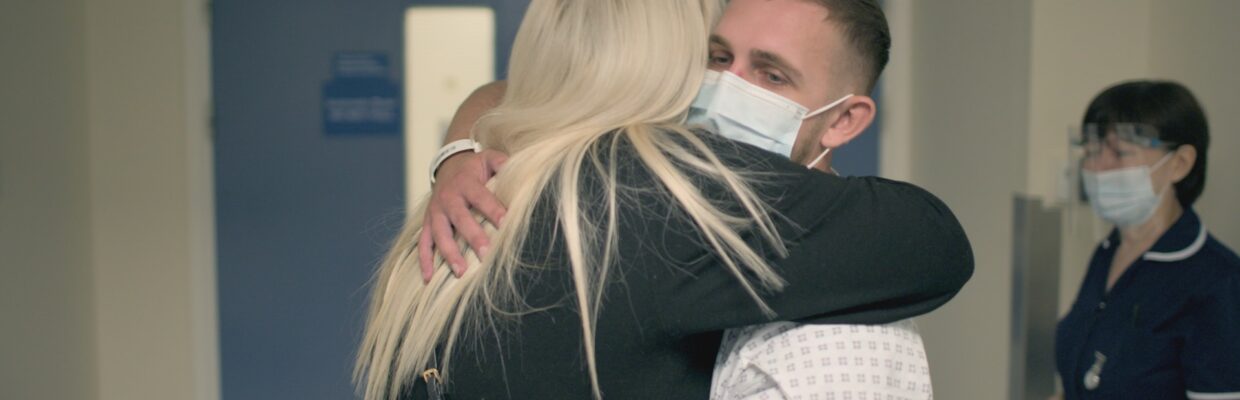 A woman hugging a patient