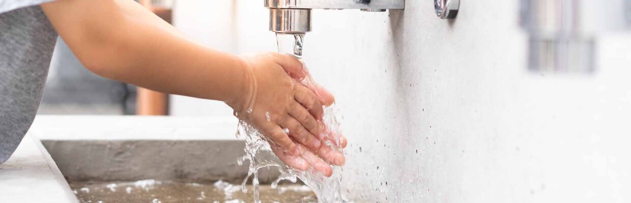 A person washing their hands