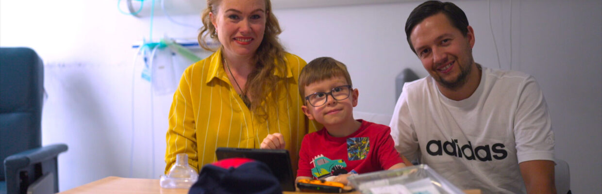 A portrait of a man and woman with a young boy