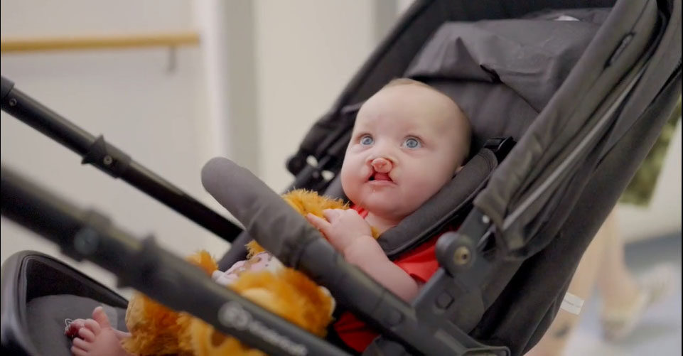 Picture of Amelia in her pushchair.