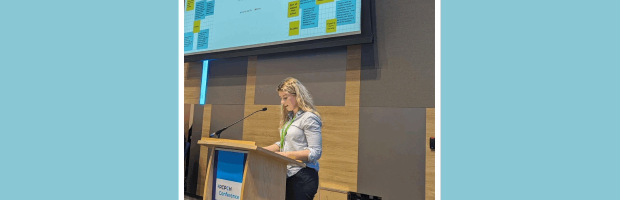 A woman speaking at a conference