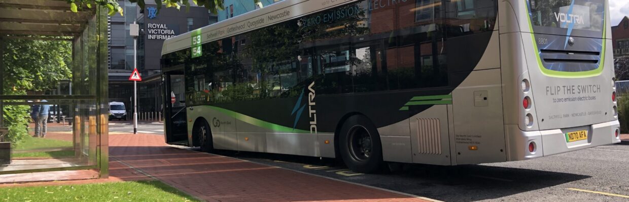 A photo of the electric hopper bus parked outside of the RVI