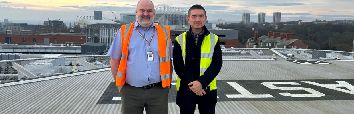 A photo of Martin and Nichol on the RVI helipad