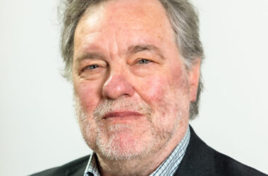 A headshot of Sir Paul Ennals