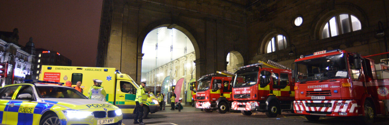 A photo of Newcastle Central Station with emergency service vehicles outside