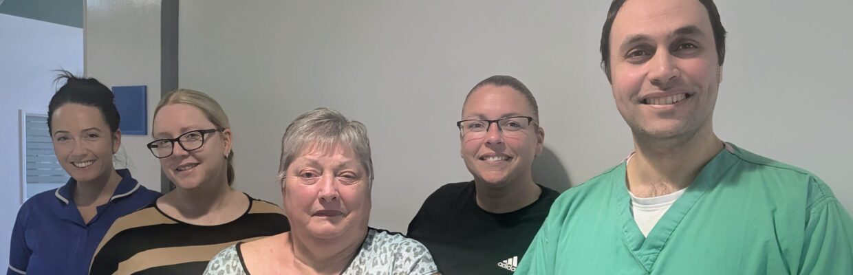 A group photo of five people