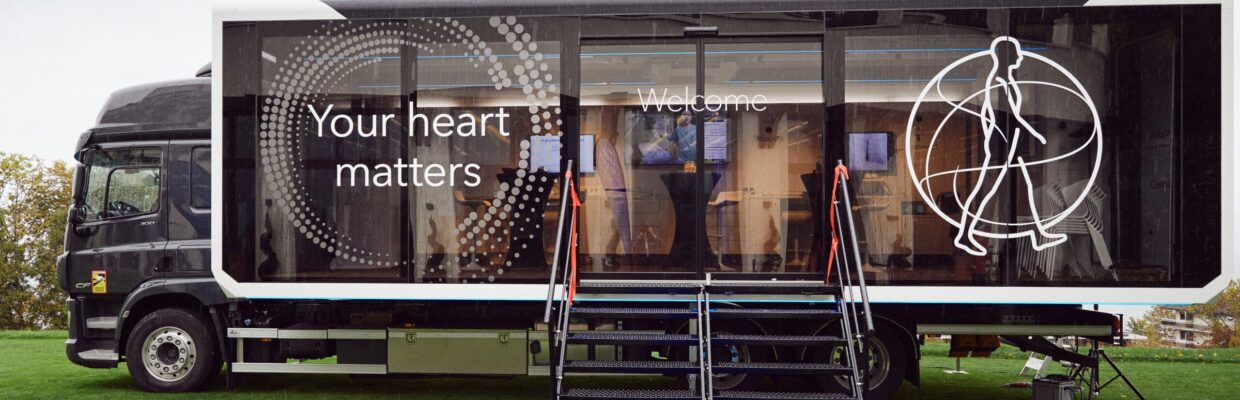 A truck carrying a portable room with the worth Your Heart Matters printed on the side