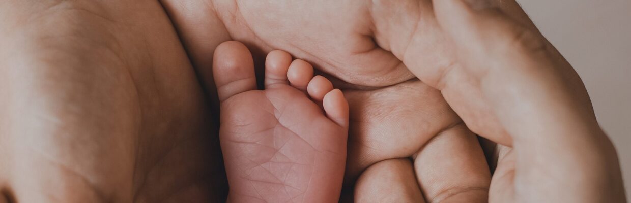 Baby foot in hands
