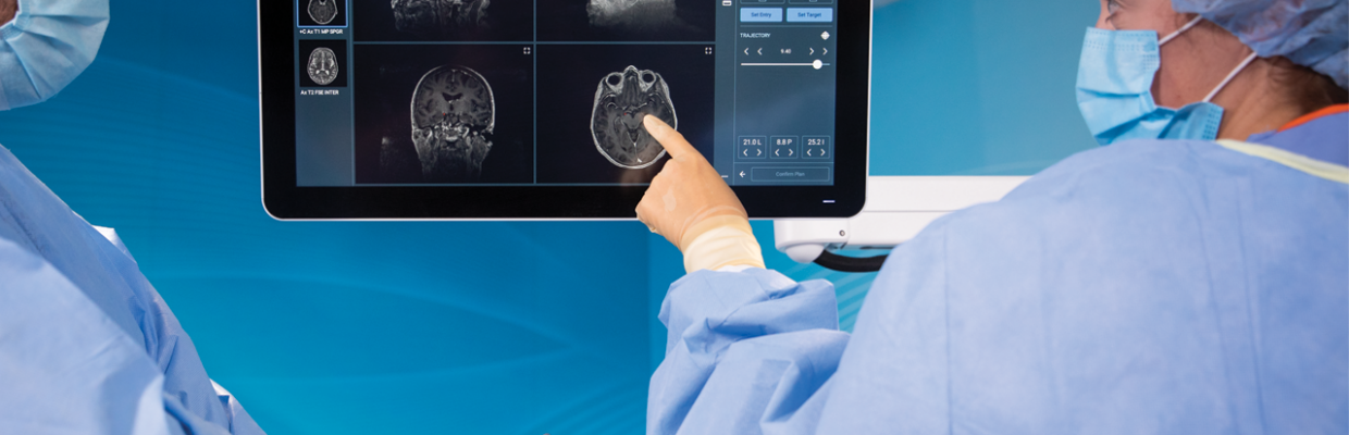 Surgeons using touch screen and robotic arm to assist brain surgery