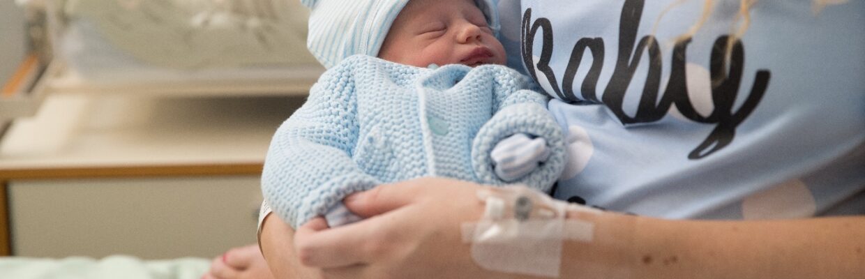 Photo of mum and newborn baby