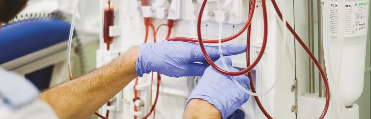 Renal nurse at dialysis machine