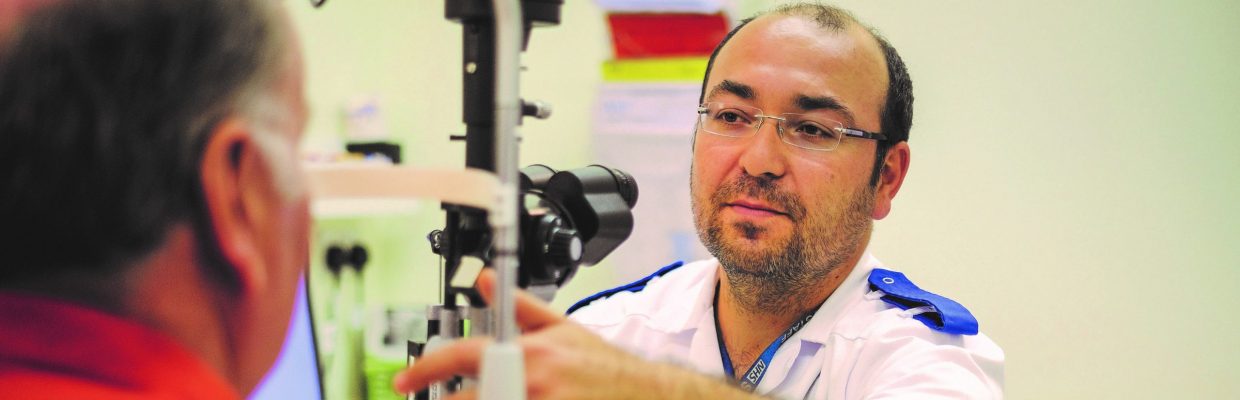 Patient having eye test with Nurse Specialist Huseyin Cetinturk