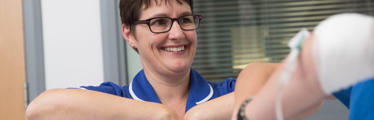 Clinical Nurse Specialist Ruth Wylie with young patient