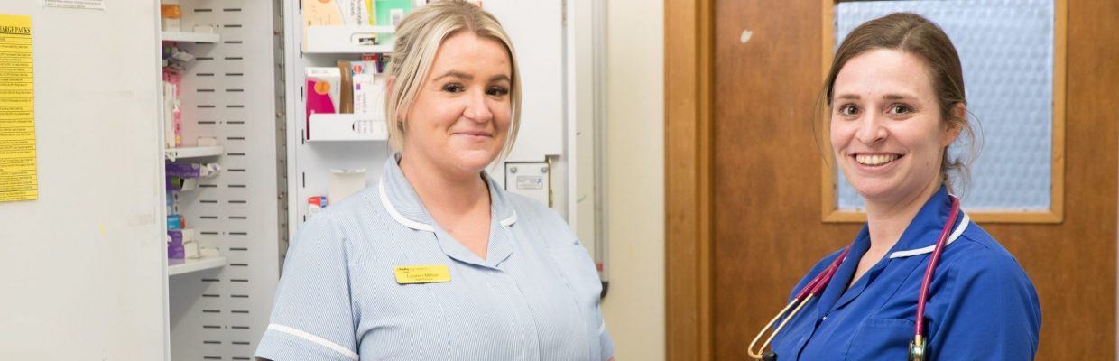 Nursing staff in secure medication cupboard on ward