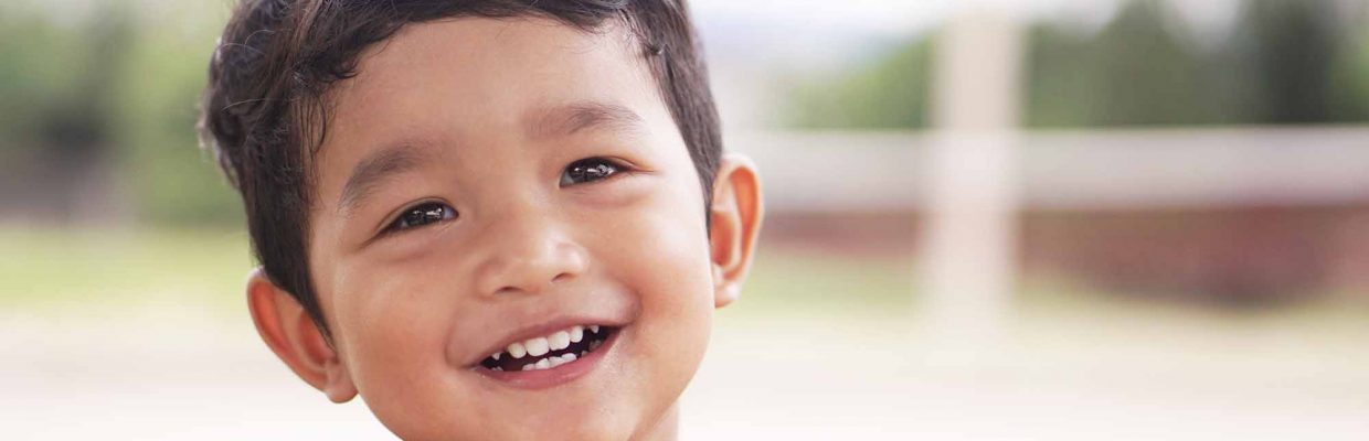 Portrait of cute happy boy close-up of smiley face little kid 2 year old.