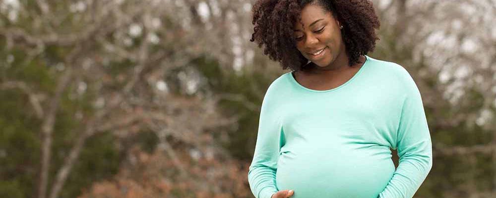 African American Pregnant Woman Outside.