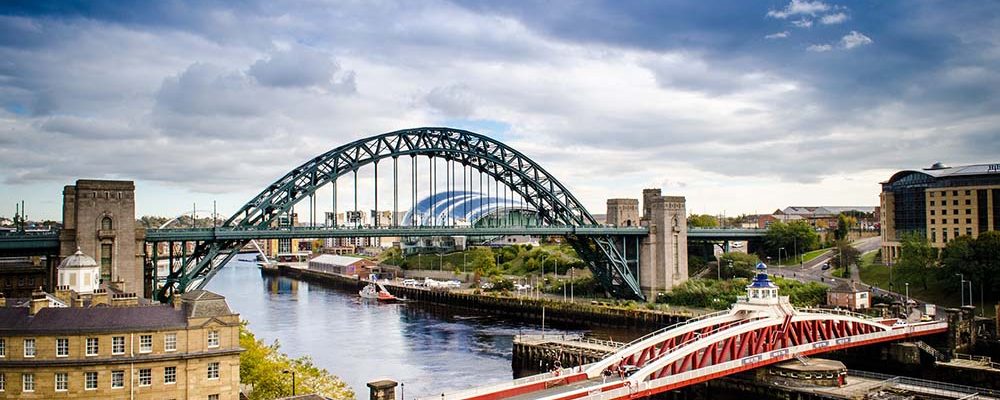 Swing Bridge and Tyne Bridge view across the tyne from Newcastle looking toward Gateshead