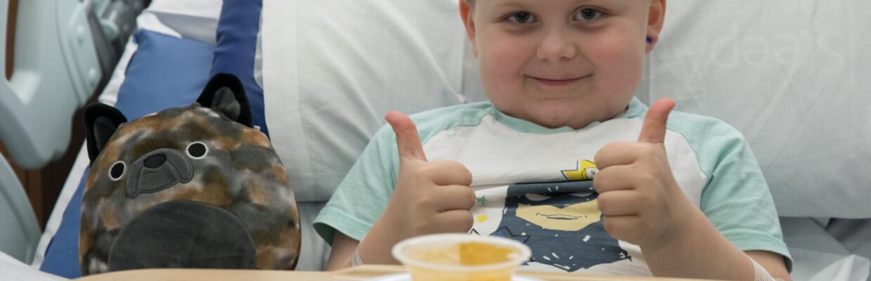 Child on a children's ward with nutritious food and drink