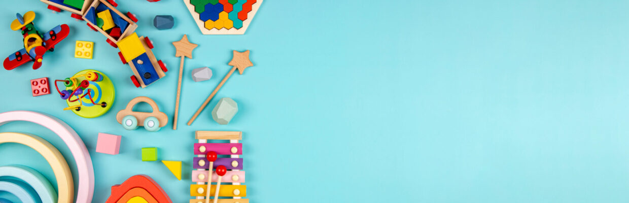 Colourful children's toys on a light blue background