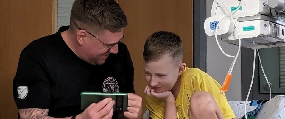 Crop 2 - Archie and his dad Mark watch a film together whilst in GNCH