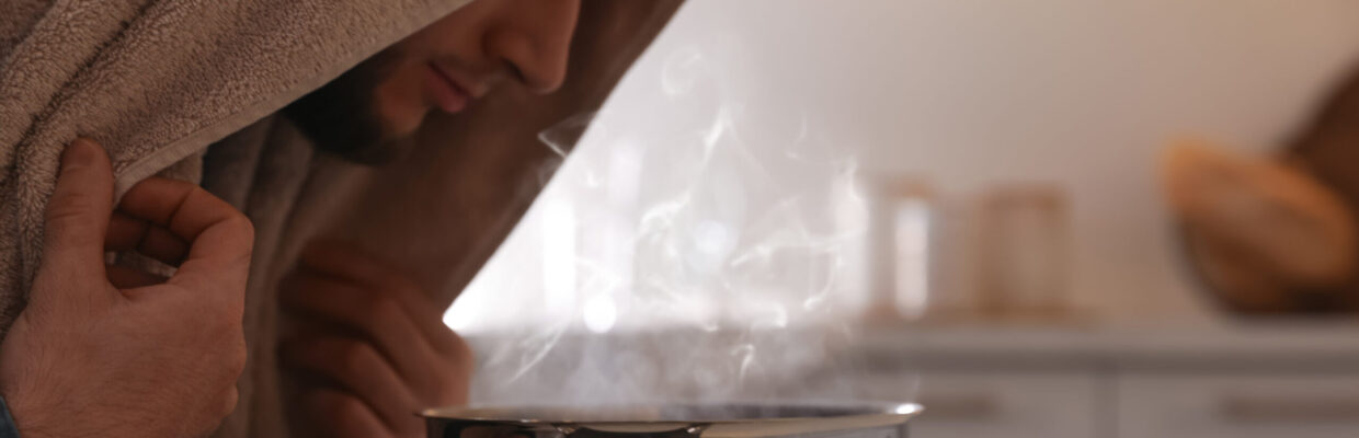 Man,Taking,Treatments,At,Table,Indoors.,Steam,Inhalation