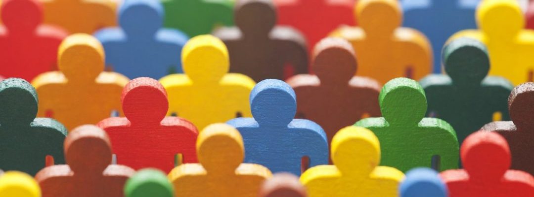Photo of wooden figures of all different colours