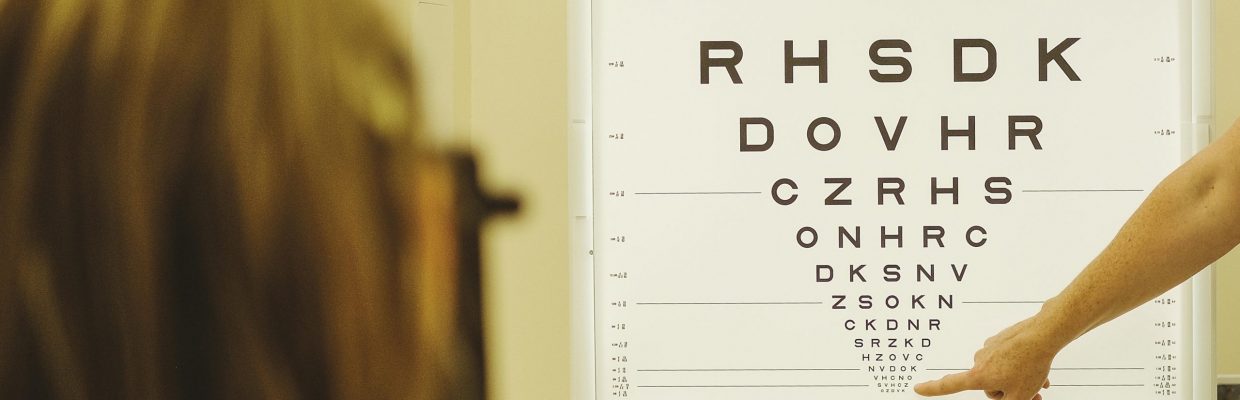 Patient having eyesight checked using the Snellen Test